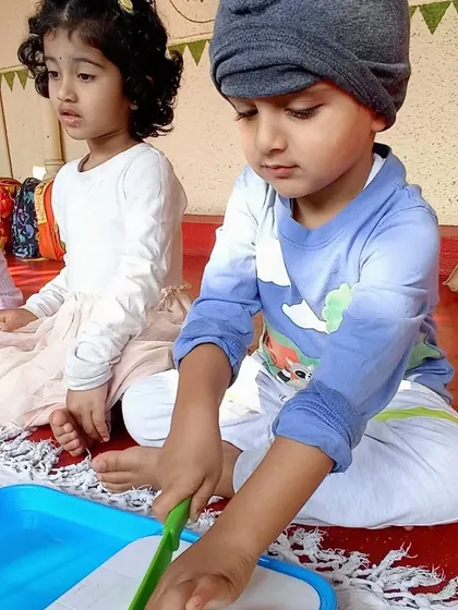 Making a healthy and delicious chickpea salad, where children practiced chopping vegetables and mixing ingredients to create a nutritious meal.