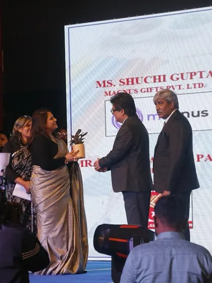 A guest of honor is presented with a token of gratitude during the Memorabilia ceremony.