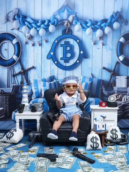 The ultimate Boss Baby portrait. With sunglasses on and surrounded by money, this little guy is the picture of confidence and charm.