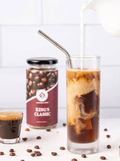 The magic moment when milk is poured into iced coffee. I use specific lighting techniques to highlight the beautiful swirls and textures created during the pour.