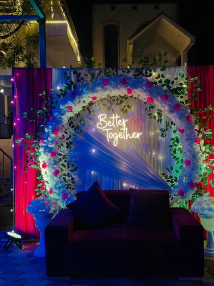 The decoration at night, with fairy lights and spotlights creating a magical effect.