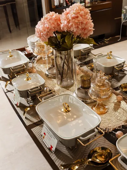 A closer look at the elegant serving ware and floral decor from the Diwali table setup. Every element is chosen to create a cohesive and beautiful dining experience.