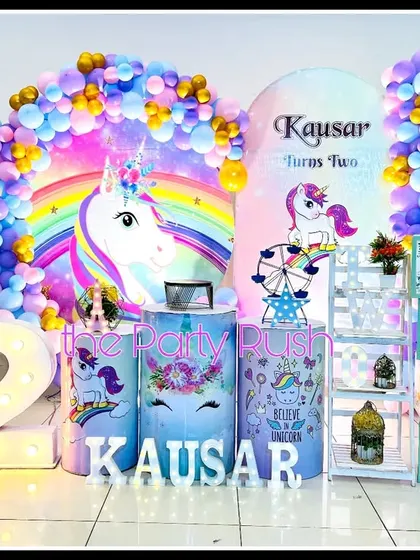 Kausar's second birthday was a magical unicorn party filled with rainbows and sparkle. The decor includes unicorn cutouts, a rainbow backdrop, and a large light-up number "2", making it a dream come true for any unicorn lover.
