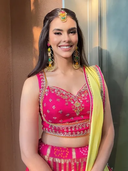 The final Mehendi look is fresh, vibrant, and full of joy. The makeup is designed to last through the festivities while feeling light and comfortable.