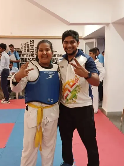A victory pose with my student Saee More after she won gold at the DSO championship. Her hard work in our competitive batches is clearly paying off.
