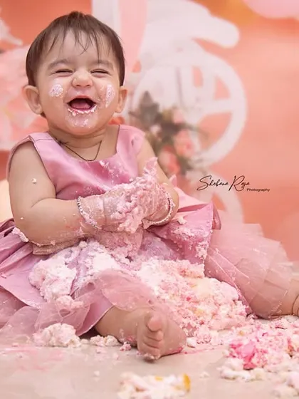 First birthdays are for making a happy mess. This cake smash session was full of laughter as she dove right into the frosting, creating a memory of pure, sweet fun.