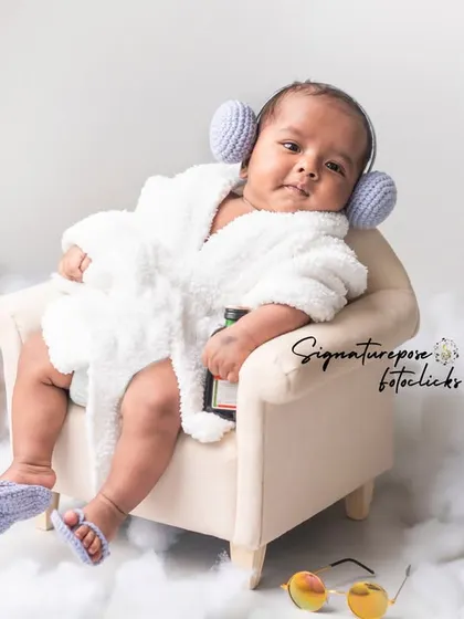 This 2.5-month-old is chilling in his spa robe, looking cool and curious. Our themes can be adapted for slightly older babies too.