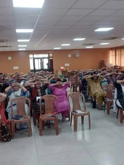 The audience participating in a mindfulness exercise. Mental wellness is just as important as physical fitness.