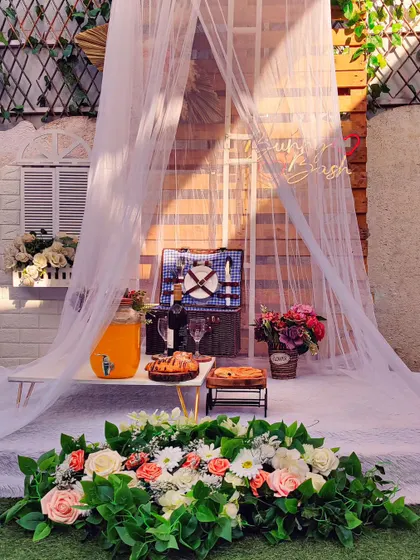 A sheer teepee provides a light and airy feel for a daytime surprise or proposal. This setup is fully customizable to match your preferred style and can be arranged at your chosen venue, be it a rooftop or backyard.