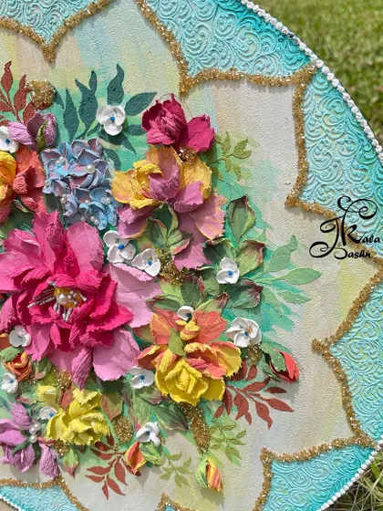 An angled view of the 14-inch circular wall art, highlighting the depth of the sculpted flowers.
