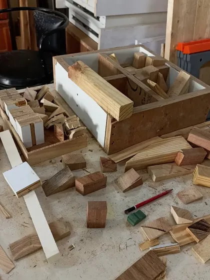 The "organized chaos" of a scrap wood project. It's amazing to see how these small, discarded offcuts can be combined to create something new and imaginative.