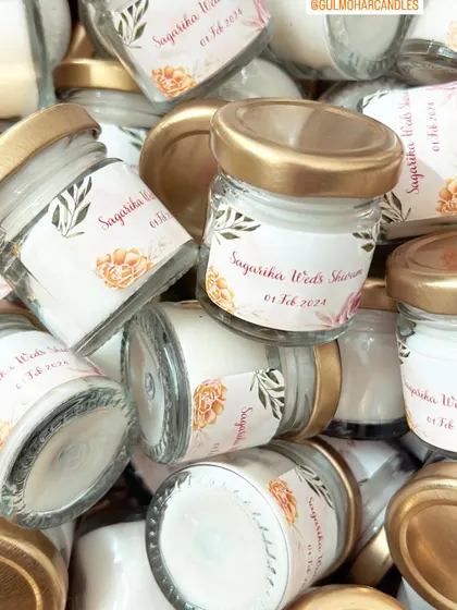 A pile of custom-labeled mini candles for a wedding. I can handle orders of any size, ensuring each candle is poured and prepared with care.