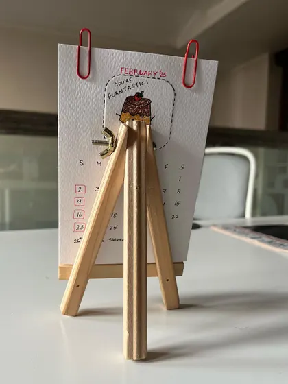 A view from the back, showing how the little wooden easel supports the calendar pages.