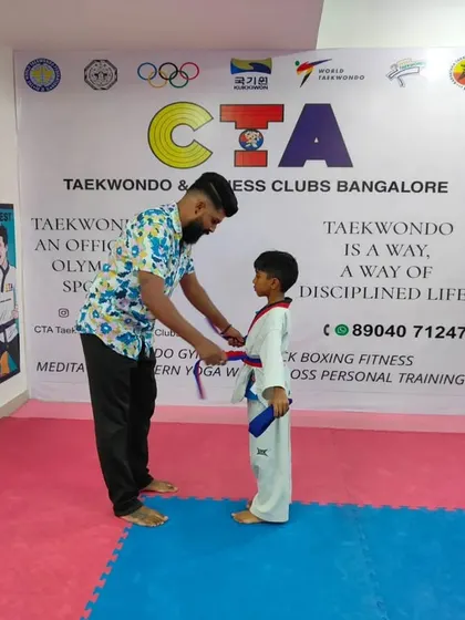 Tying a purple belt.