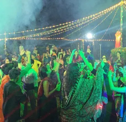 Smoke and green lights add a festive touch to the Diwali party.