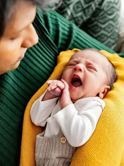 That big newborn yawn. Black and white is perfect for capturing these funny and fleeting moments in a classic way.