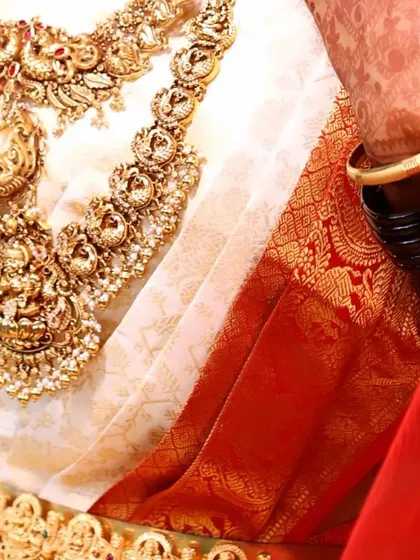 The beautiful textures of a Kanjeevaram silk saree paired with layers of traditional gold jewellery. Every element comes together to create the perfect bridal ensemble.