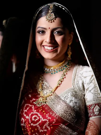 A beautiful portrait of Siya. The dark background makes her flawless makeup and bright smile stand out. This is timeless bridal beauty.