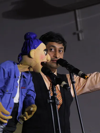 A close-up shot during my performance at NIT Trichy, showing the intricate interaction between me and the puppet.