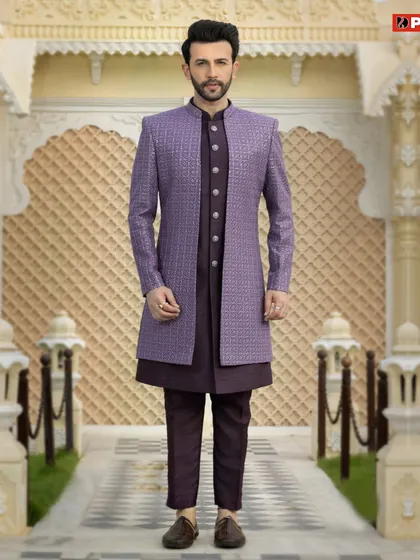 For a look that is both royal and modern, I recommend a Jodhpuri suit like this one. This particular piece features a textured purple bandhgala jacket over a matching dark kurta and trousers, creating a sharp, layered silhouette perfect for a reception or sangeet.