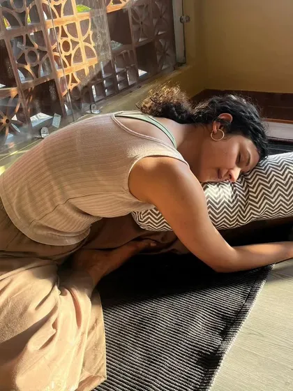 Sometimes, the practice is about slowing down and finding complete rest. Using props like a bolster in a restorative pose allows the body to release tension and the mind to find a state of deep calm and peace.