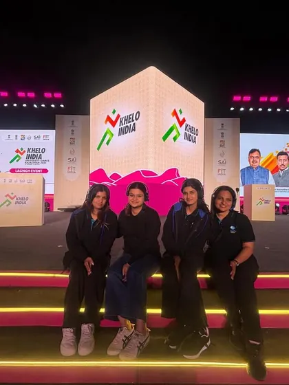 Our team takes a moment for a photo on the stage of the Khelo India University Games launch. We are proud to contribute to national events.