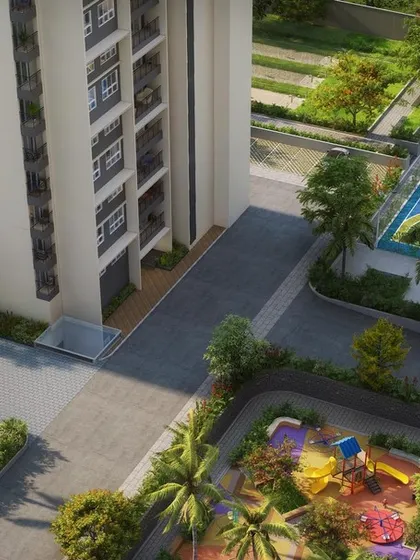 This aerial view shows a colorful basketball court and a children's play area at Sattva Lumina, demonstrating how we co-locate amenities for different age groups.