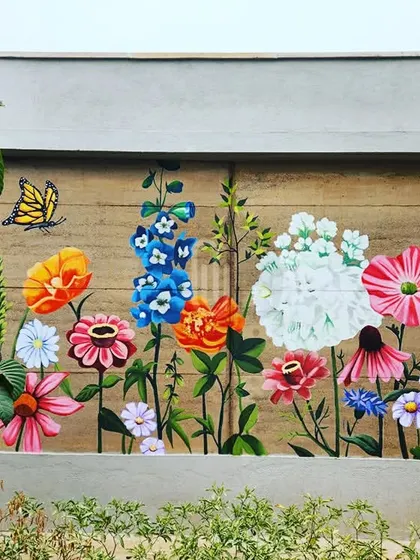 A vibrant garden of wildflowers painted on an exterior wall at the Gwalior resort. This cheerful and colorful mural brightens up the entire area.