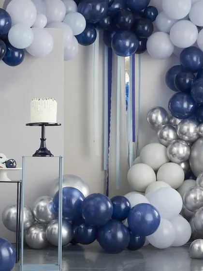 A modern balloon arch in shades of navy, blue, and silver, perfect for a boy's baby shower, birthday, or corporate event.