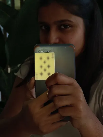 A student showing off the incredible translucency of a porcelain playing card. We might have peer-pressured her into using porcelain, but the result was totally worth it!