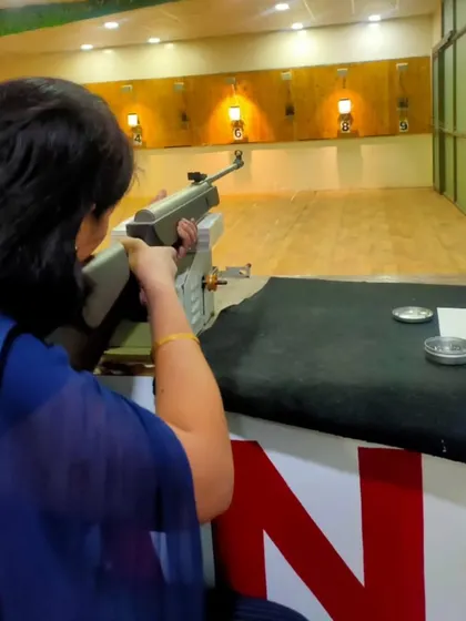 Another one of our visitors getting comfortable with the air rifle. Our coaches are always on hand to help with stance and aiming.