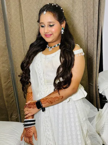 The client posing, showing off her full look.
