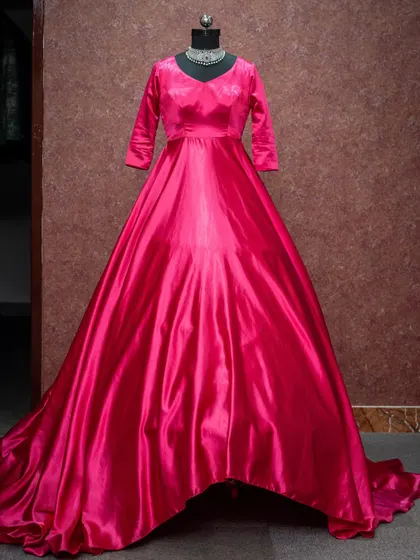 A stunning fuchsia pink gown with a long trail for those dramatic, flowing shots.