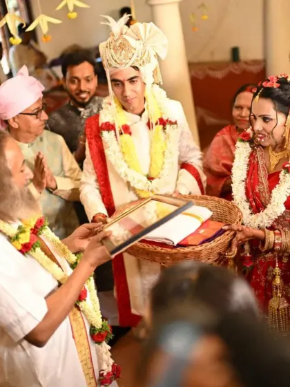 A couple offers a token of gratitude to Gurudev during their wedding. This moment captures the deep respect and devotion that is woven into the fabric of our ashram weddings.