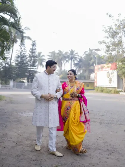The couple takes a walk together after their wedding, a quiet moment to themselves as newlyweds.