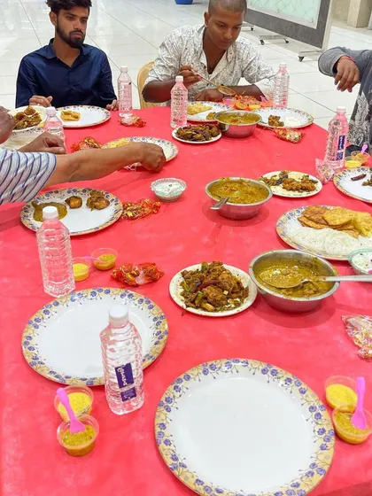 Guests enjoying a meal at the Royal Convention Hall in Mysore. Our service extends beyond Bangalore, bringing our signature biryani and catering expertise to events in surrounding cities.