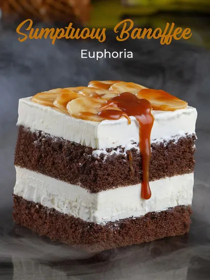 Our Sumptuous Banoffee Euphoria ice cream cake. Layers of chocolate sponge and banana ice cream, topped with banana slices and a rich caramel drizzle.