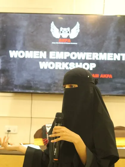 A strong voice can give hope to thousands. During our workshop, a participant shares her thoughts, demonstrating the confidence we aim to build in every woman who trains with us.