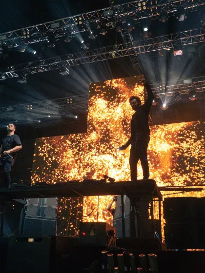 A fiery shot of Martin Garrix and Ranbir Kapoor on stage together, a moment of pure star power.
