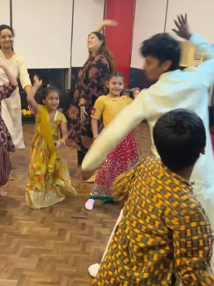 An instructor joins our young students for a dance during the Diwali jam. We encourage parents and teachers to join in the fun, making it a true community event.