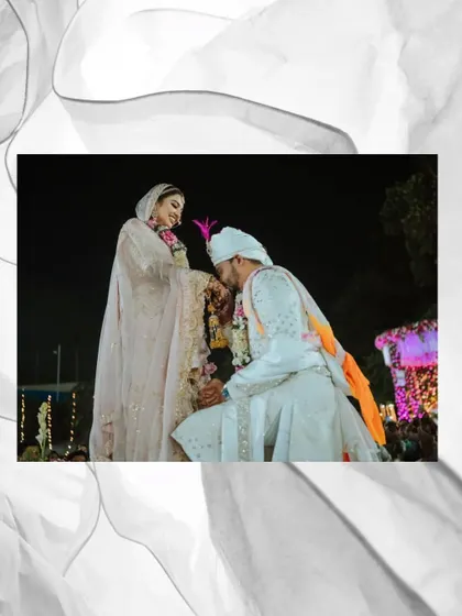 A touching moment of the groom showing respect to his bride during their wedding ceremony.
