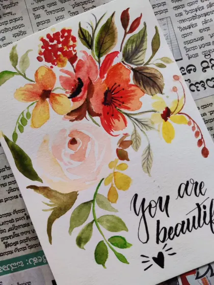 A hand-painted floral card with the calligraphy message "You are beautiful." These cards are perfect for birthdays, thank you notes, or just to brighten someone's day.