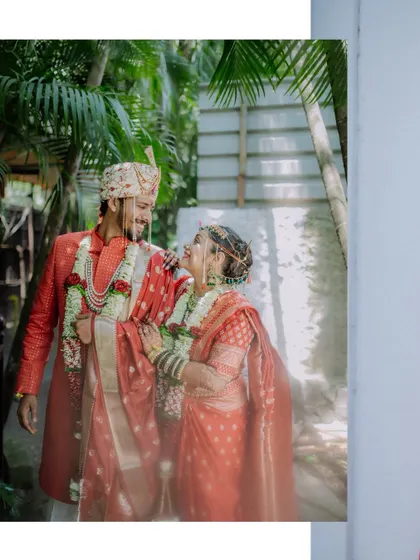 A candid moment of the couple sharing a look of love and admiration, captured in a natural outdoor setting.