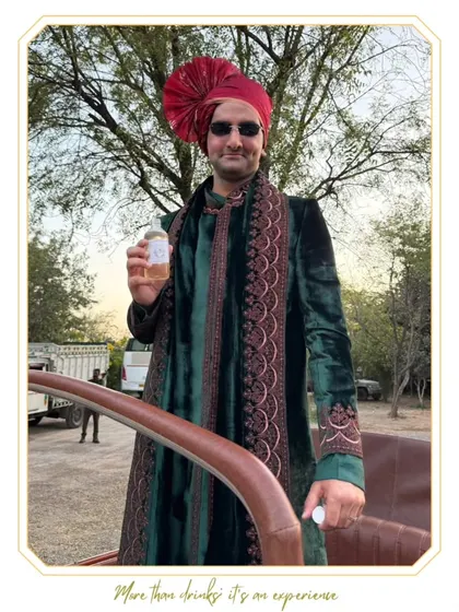 A guest at a Baraat enjoying one of our convenient pre-batched cocktails. We make sure the celebration starts right from the procession.