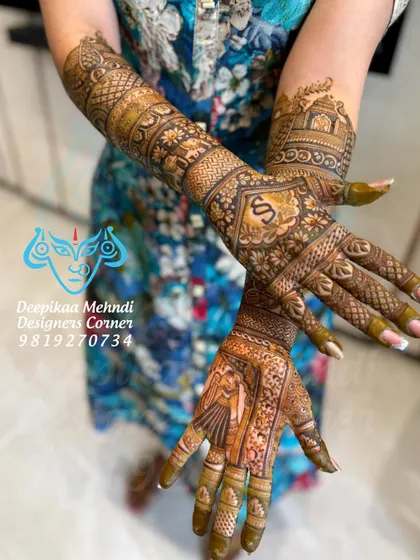 A dynamic pose showing the front and back of the hands. This allows you to see how the story continues, with bride and groom portraits on the palms and the couple's initials on the back.