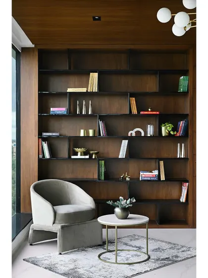 A full view of the custom bookshelf and reading nook, featured for its elegant design and meticulous styling. This space serves as a quiet sanctuary within the bustling office.