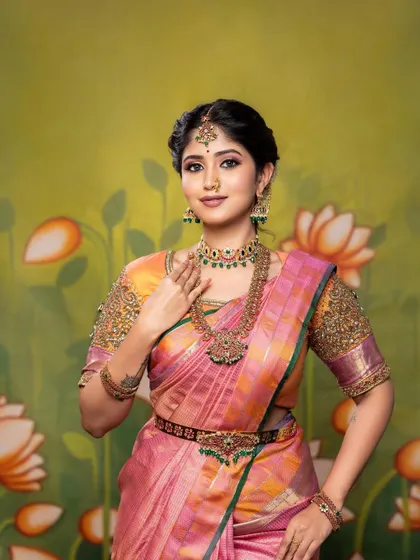 This portrait showcases the full bridal look, including the saree, blouse, and a complete set of traditional jewellery, all tied together with my signature makeup style.
