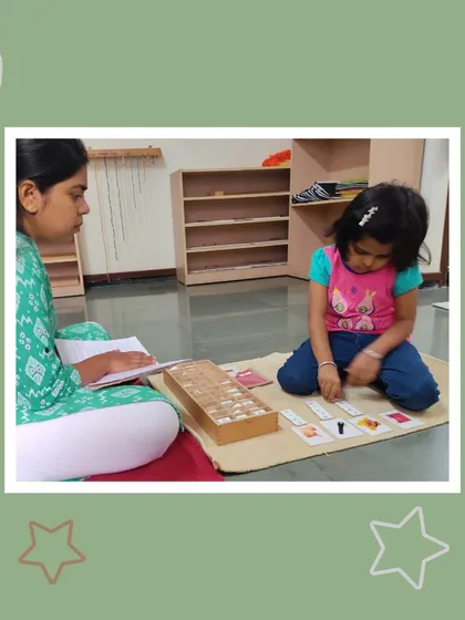 Manvitha works with phonetic reading cards, sounding out words. This activity is a crucial step in the journey to becoming a confident and fluent reader.