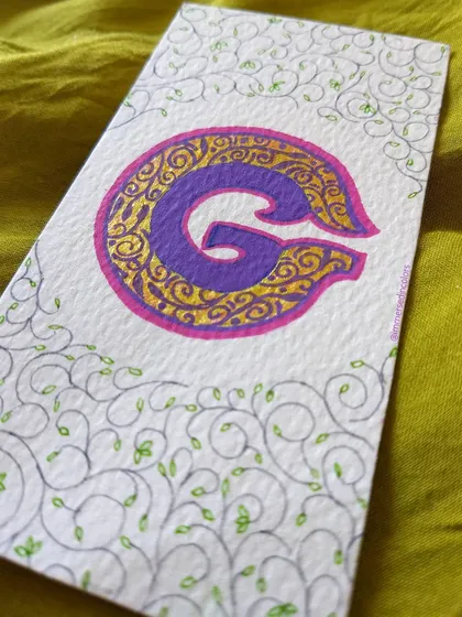 An illuminated letter 'G' for 'Gratitude'. I filled the letter with intricate golden doodles and surrounded it with delicate vines, just playing with patterns and shimmer.