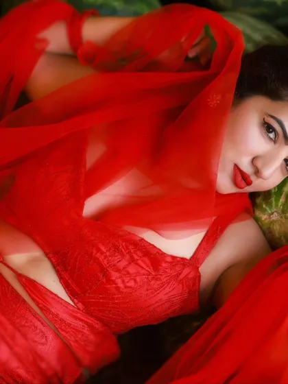 A creative and vibrant summer-themed shoot with an actress in a red outfit surrounded by watermelons. This series is playful and colorful, perfect for a brand campaign or a unique portfolio piece.